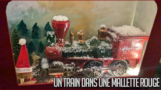Un train dans une mallette rouge